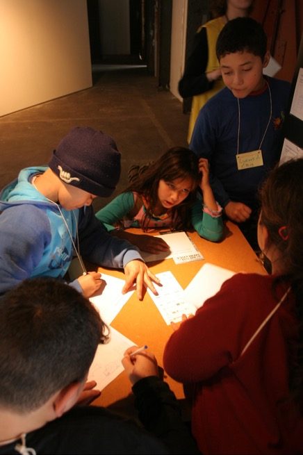 Visitors at one of the pedagogical stations designed by Luis Camnitzer at the 6th Bienal do Mercosul, 2007. Image courtesy of the Fundação Bienal do Mercosul.