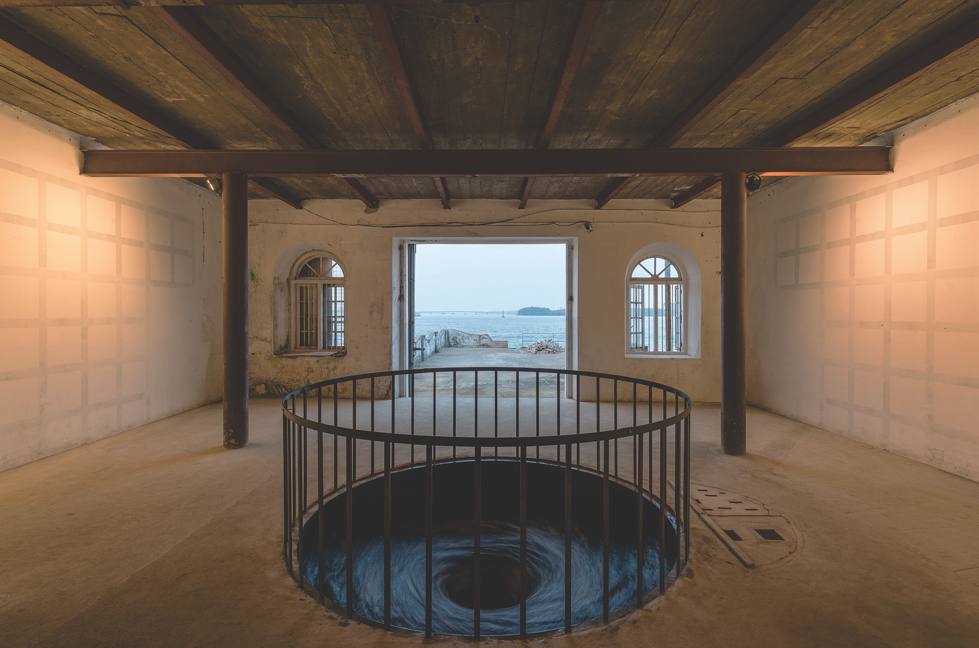 Anish Kapoor, ''Descension,'' 2014. Metallic container and water. Dimensions variable. Installation view at Aspinwall House, Fort Kochi.