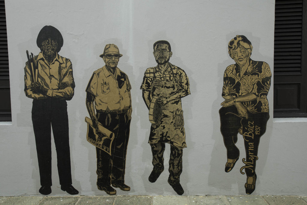 ''Grabadores por Grabadores.'' Life-size prints posted on the streets. 4th San Juan Poly/ Graphic Triennial 2015.