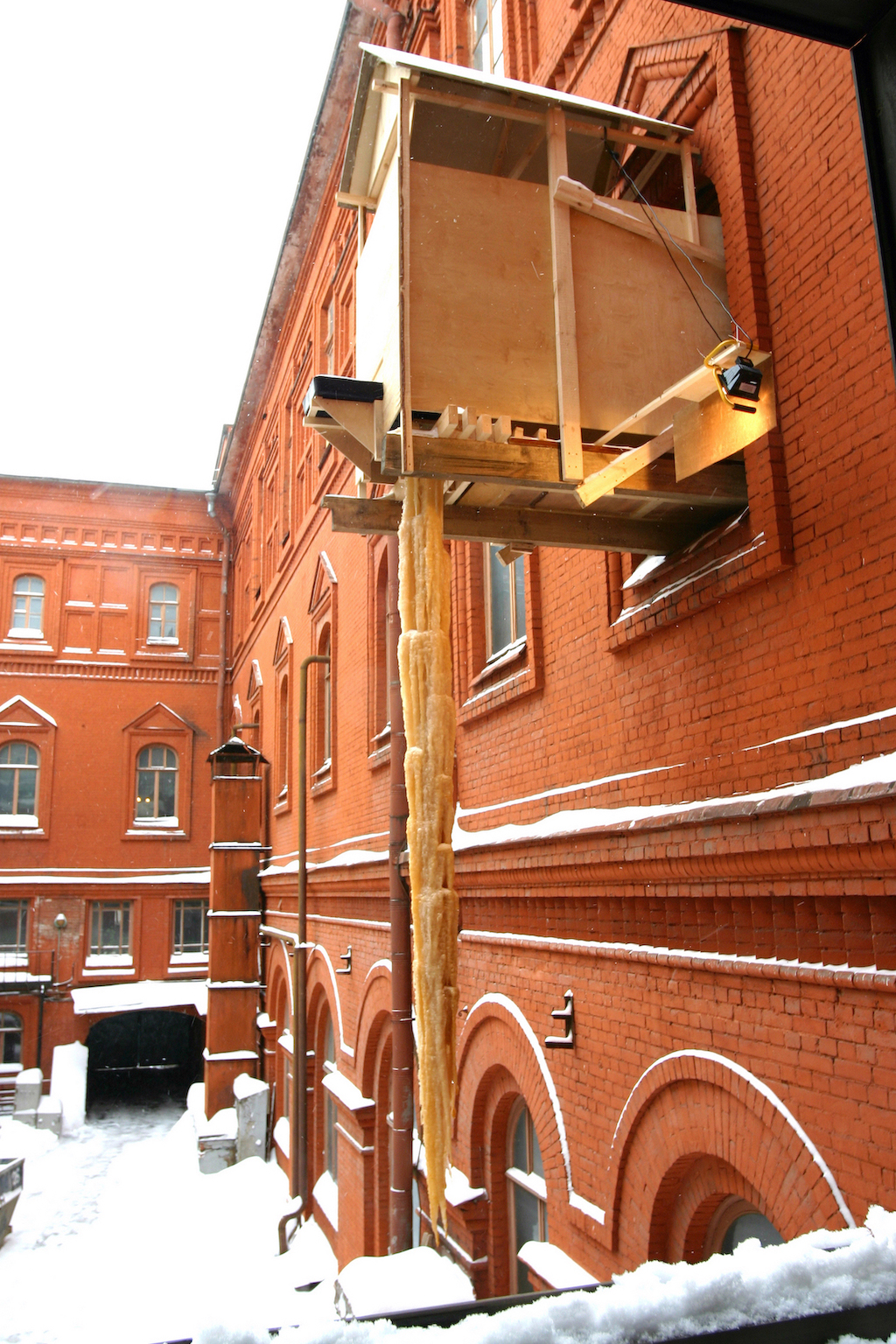 Gelatin, ''Zapf de Pipi,'' 2005 Installation: wooden structure, toilet and ice sculpture (water, metabolic waste, salt and organic matter). Ice sculpture: approx. 7 m x 1 m. Installation view of ''Dialectics of Hope'' at the Lenin Museum, 1st Moscow Biennale of Contemporary Art, Russia, 2005. Photo: © Moscow Biennale