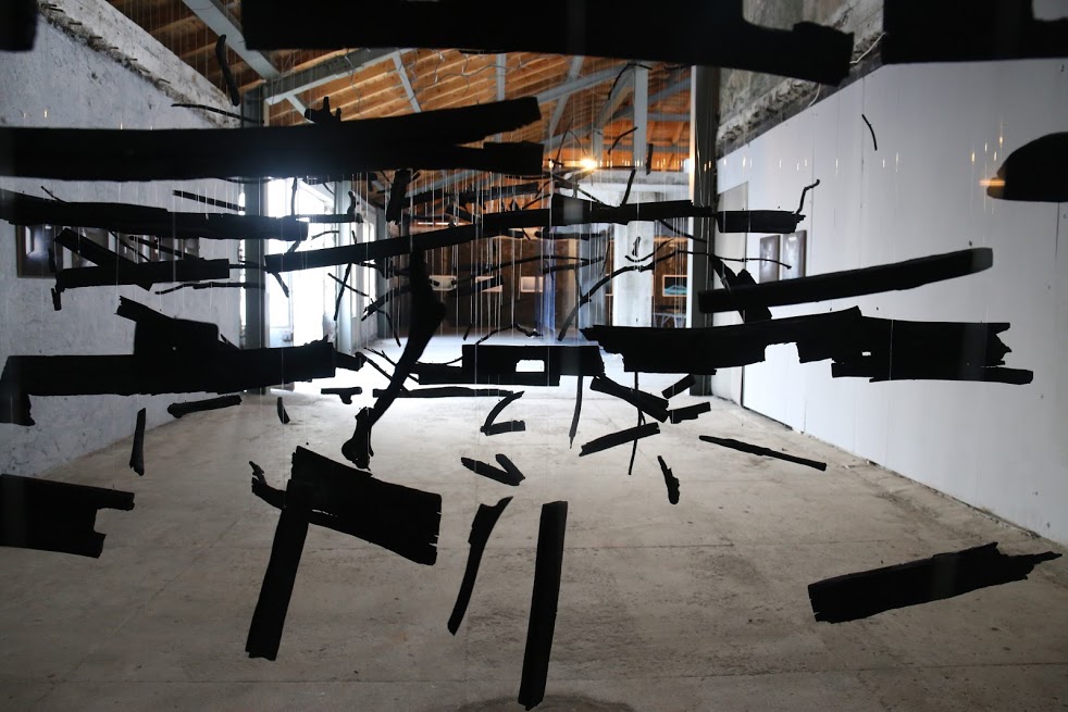 Ulrike Mohr, ''Black Sea Resonance,'' 2017. Installation with charcoal sourced and produced on site. Installation view of Sinopale 6 at the former Ice Factory Buzhane, Sinop. Photo: Sinopale